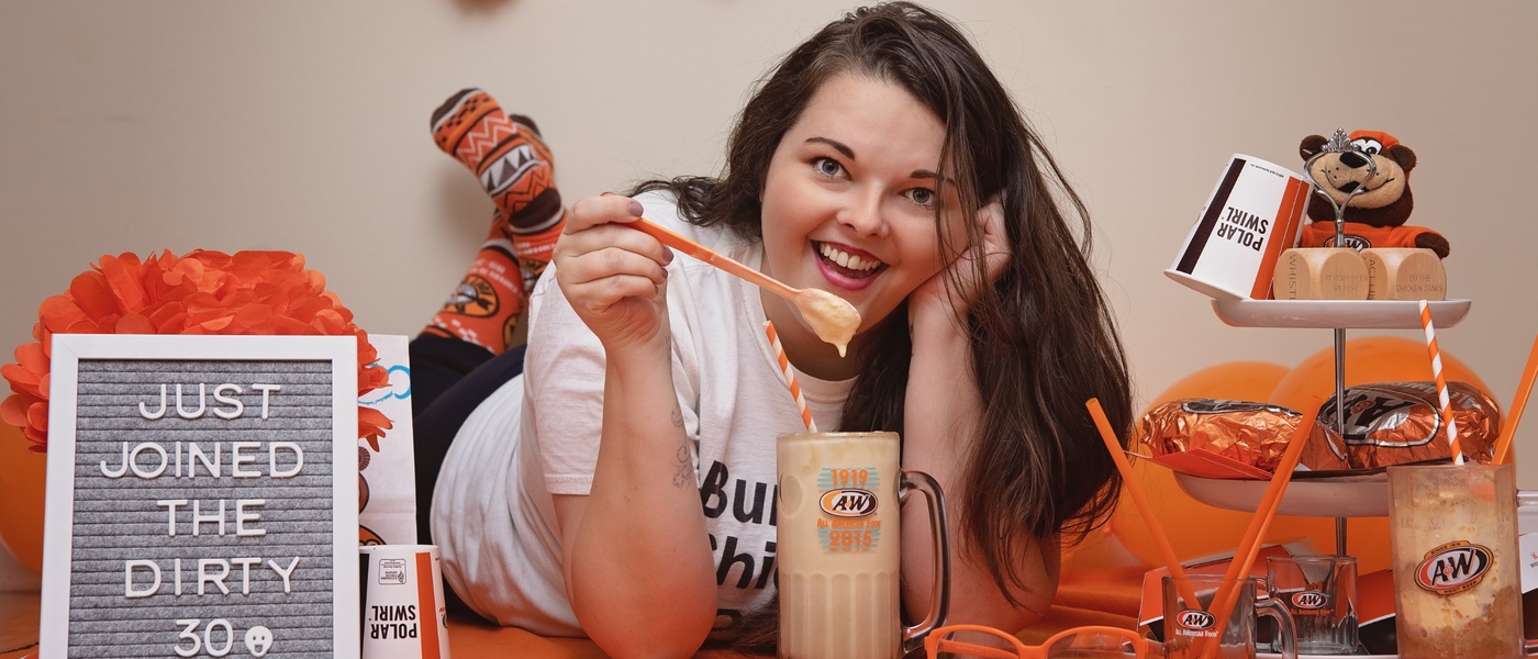 Briana with root beer float in A&W Restaurants mug